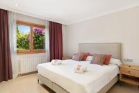 Postel nebo postele na pokoji v ubytování Villa Luna Suites