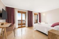 Postel nebo postele na pokoji v ubytování Villa Luna Suites