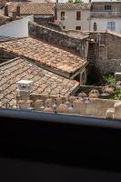 an overhead view of roofs of buildings in a city at Maison Arthur in Aigues-Mortes