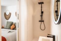 a bathroom with a shower and a sink at Maison Arthur in Aigues-Mortes