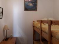 a bedroom with two bunk beds and a picture on the wall at Bel appt 3 * plein Centre ville 4 pers. + balcon in Cauterets