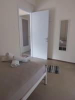 Posteľ alebo postele v izbe v ubytovaní Luminosa Seaview Apartment