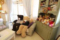 two teddy bears sitting on a chair in a room with stuffed animals at Bear Meets Moose Homestay B&amp;B in Puli