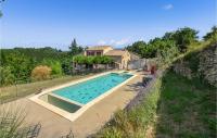 a swimming pool in front of a house at Nice Home In Taulignan With Wifi in Taulignan