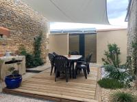 Patio alebo iná vonkajšia časť ubytovania GITE L’INTEMPOREL