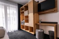 A television and/or entertainment centre at DAS MORITZ- Fine Living Apartments