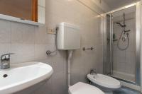 a bathroom with a toilet and a sink and a shower at Hotel Casa Boccassini in Venice