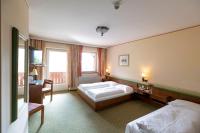 Ein Bett oder Betten in einem Zimmer der Unterkunft Hotel Gasthof Lercher