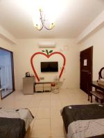 a living room with a heart painted on the wall at Happy Heart B&amp;B in Taitung City