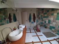 a bathroom with two sinks and a bath tub at Loft en duplex 270 m2 &amp; Jardin patio terrasse sauna in Chaville