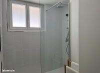 a bathroom with a shower with a glass door at Appartement idéalement situé Font romeu in Font-Romeu-Odeillo-Via