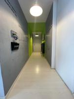 a corridor of an office with green and gray walls at F4 lumineux proche du stade de France in Saint-Denis