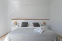 A bed or beds in a room at Tauro Villas Deluxe