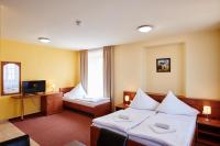 Postel nebo postele na pokoji v ubytování Hotel Zlatá Hvězda