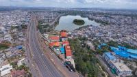 una vista aérea de una ciudad con una carretera y un río en Mayur Belgaum Presidency Hotel &amp; Spa, en Belgaum