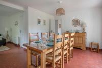a dining room with a table and chairs at Detente au calme et pres de la plage in Saint-Gildas-de-Rhuys