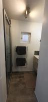 a bathroom with a shower and a sink and a mirror at Studio en plein cœur de la ville in Mazan