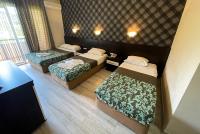 A bed or beds in a room at CASTLE PARK HOTEL