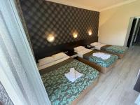 A bed or beds in a room at CASTLE PARK HOTEL