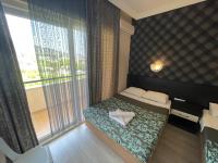 A bed or beds in a room at CASTLE PARK HOTEL