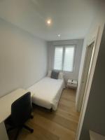 A bed or beds in a room at Habitaciones Arrisal