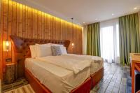 a bedroom with a large bed in a room at Vlasinsko jezero VILA BEST in Surdulica