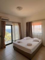 Posteľ alebo postele v izbe v ubytovaní Panorama Village Hotel