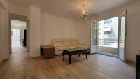 a living room with a couch and a table at New two bedroom apartment with AC by the sea in Nice