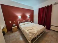 A bed or beds in a room at Standart Apartments , Glyfada Beach