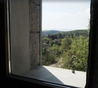 a window with a view of a mountain view at Les Faveyrolles à Labeaume in Labeaume