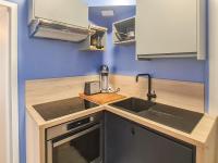 a kitchen with a sink and a counter top at Cosy&#39;Appart - LE SAINT MAUR in Rouen