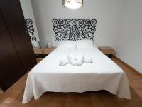 Postel nebo postele na pokoji v ubytování APARTAMENTO AL-ALBA