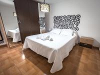 Postel nebo postele na pokoji v ubytování APARTAMENTO AL-ALBA