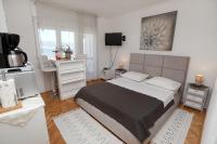 Posteľ alebo postele v izbe v ubytovaní Apartments ITD