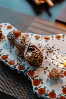 a pastry on a plate with nuts and seeds at Splendid Hotel Taormina in Taormina