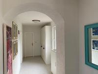 an empty hallway with an archway in a house at Villa Yucca Istra in Labin