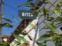 a sign that says gifts next to a building at Gite 65 in Chartres