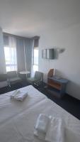 En eller flere senger p&aring; et rom p&aring; Hotel Banat