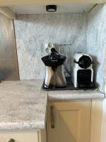 a kitchen counter with a coffee maker and a toaster at Logement spacieux idéal famille in Marseille