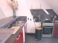 a small kitchen with a sink and a stove at APPARTEMENT 100 M DE LA PLAGE LE PORTEL in Le Portel