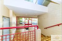 a staircase in a building with red railings at Le Mykonos¶ Gare¶ 2Garages ¶Jardin ¶Spacieux in Grenoble