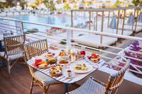 a table with plates of food on top of a boat at TRS Ibiza Hotel - Adults Only in San Antonio