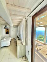 A bed or beds in a room at Koumaros Villas
