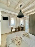 A bed or beds in a room at Koumaros Villas