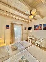 A bed or beds in a room at Koumaros Villas