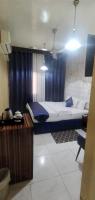 Postel nebo postele na pokoji v ubytování Golden Star Hotel