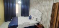 Postel nebo postele na pokoji v ubytování Golden Star Hotel