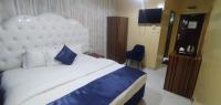 Postel nebo postele na pokoji v ubytování Golden Star Hotel