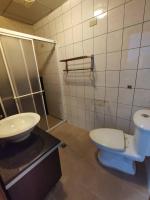 a bathroom with a toilet and a sink at Love in Hualien B&amp;B in Hualien City