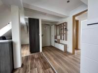 an empty room with a hallway with wood floors at Apart Pension Plaue in Brandenburg an der Havel